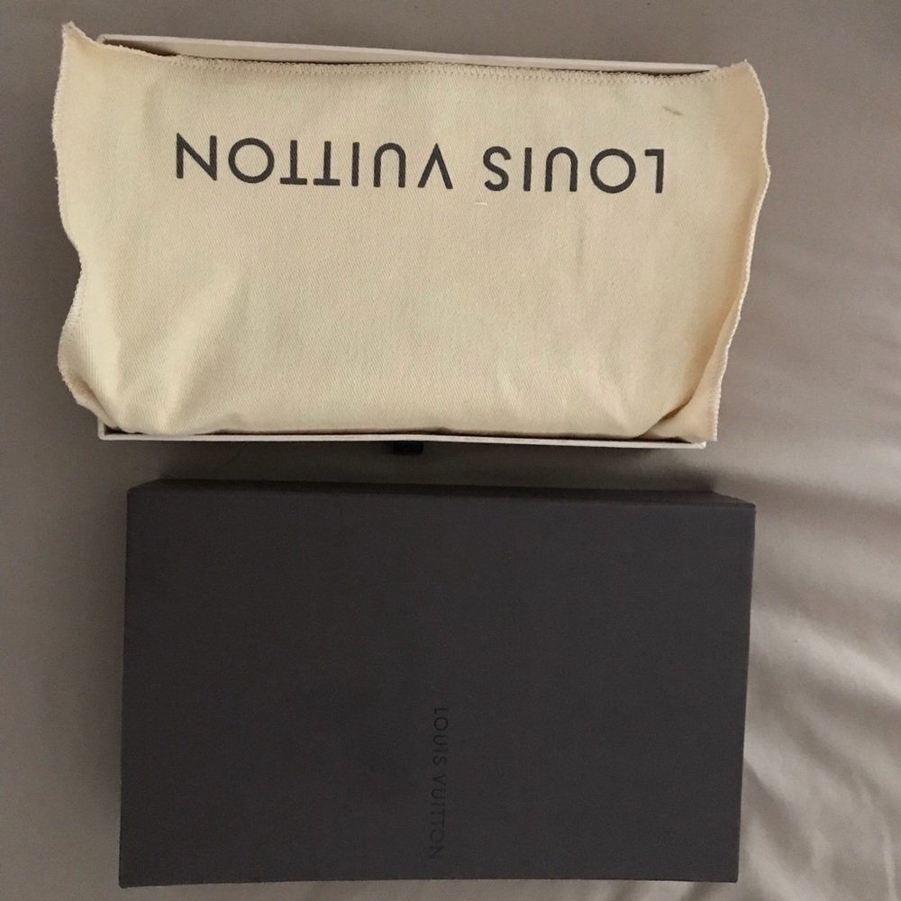 Louis Vuitton navy blue wallet. Never used.